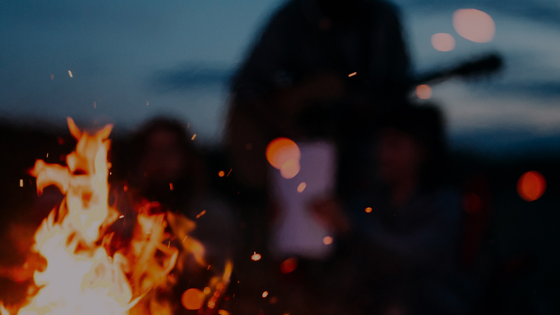 consumers gather around a giant fire to make S'mores 